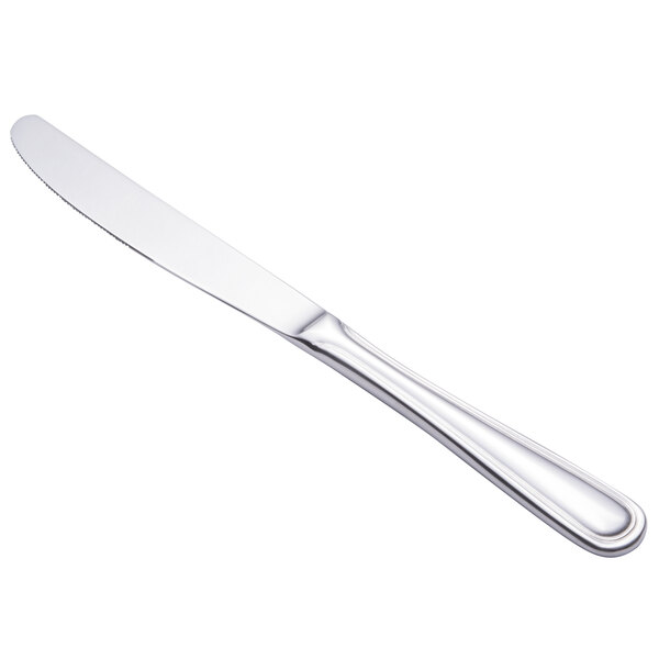 A Walco Marcie stainless steel dinner knife with a silver handle.