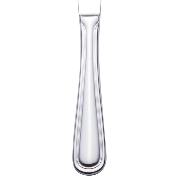 A close-up of a Walco stainless steel dinner knife with a silver handle.