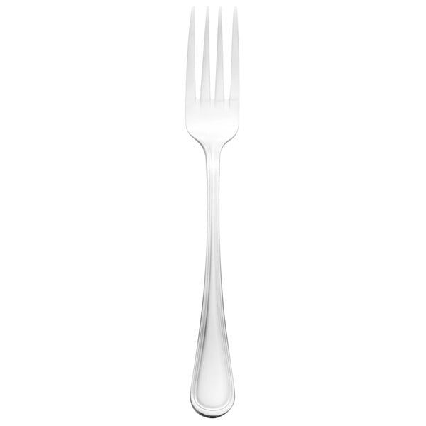 A silver Walco Marcie European table fork with a white handle.