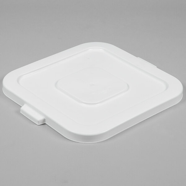 A white plastic Continental lid with a black circle clip.
