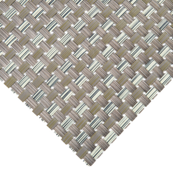A close up of a taupe and light green woven vinyl placemat.