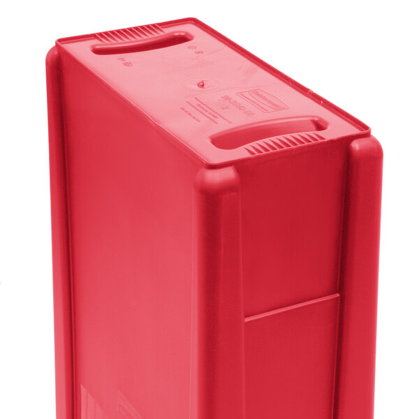 A red Rubbermaid Slim Jim rectangular trash container with two hole lid slots.