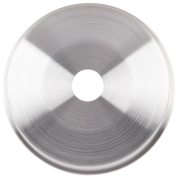 A silver circular lid with a hole in the middle.