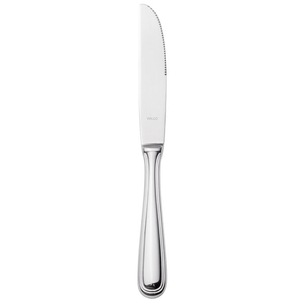 A Walco stainless steel dinner knife with a silver hollow handle.