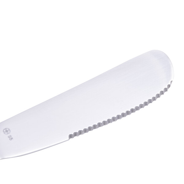 A Libbey stainless steel steak knife with a hollow white handle.