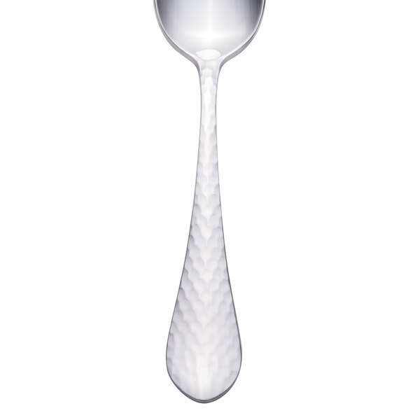 A silver teaspoon with a textured white handle.