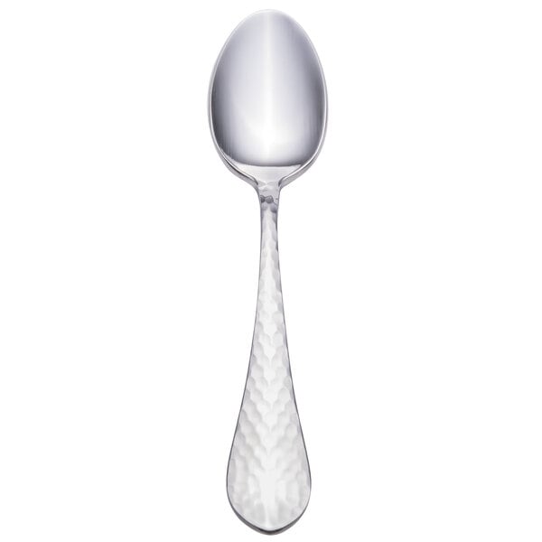 A Walco stainless steel teaspoon with a silver handle.