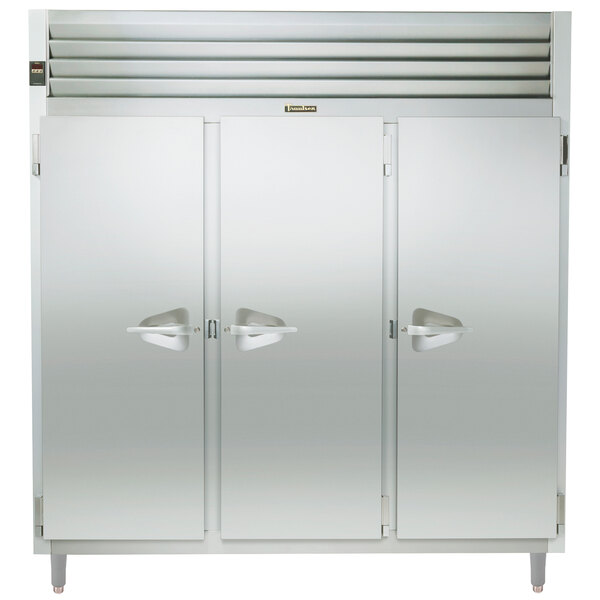 A Traulsen stainless steel holding cabinet with three solid doors open.