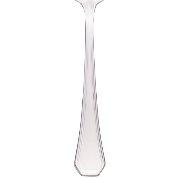 A Walco stainless steel dessert spoon with a long handle.