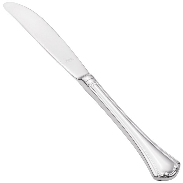 A Walco stainless steel table knife with a hollow handle and a long blade.