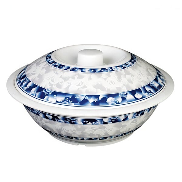 A white and blue bowl with a round top and lid.