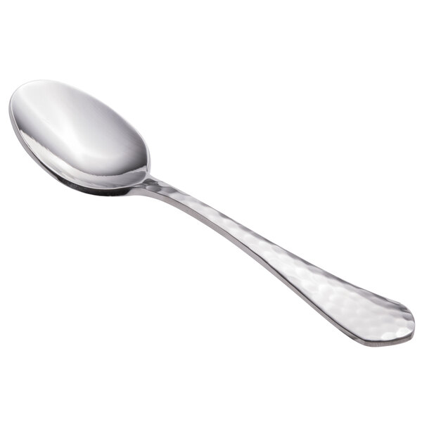 A close-up of a Walco stainless steel demitasse spoon with an ironstone handle.