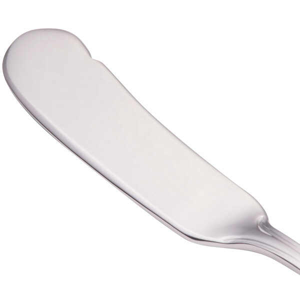 A Walco stainless steel butter spreader with a flat handle.