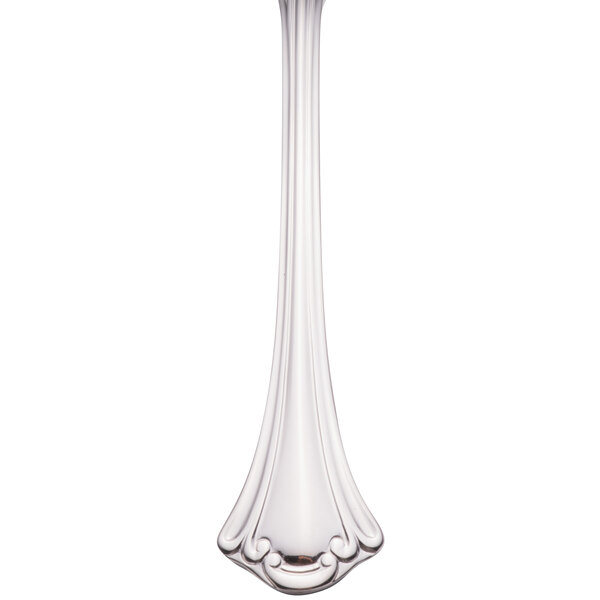 A close-up of a Walco stainless steel fish fork with a flat handle.