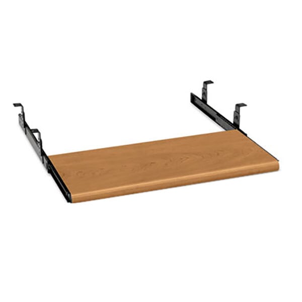 A wood plank with black metal brackets attached.