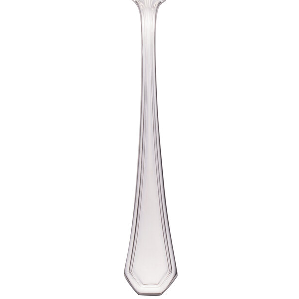 A Walco stainless steel dinner fork with a long handle.