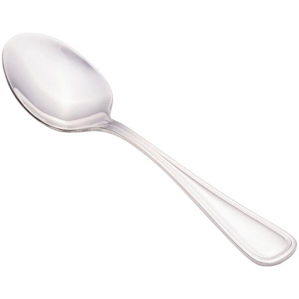 A close-up of a Walco stainless steel dessert spoon with a silver handle.