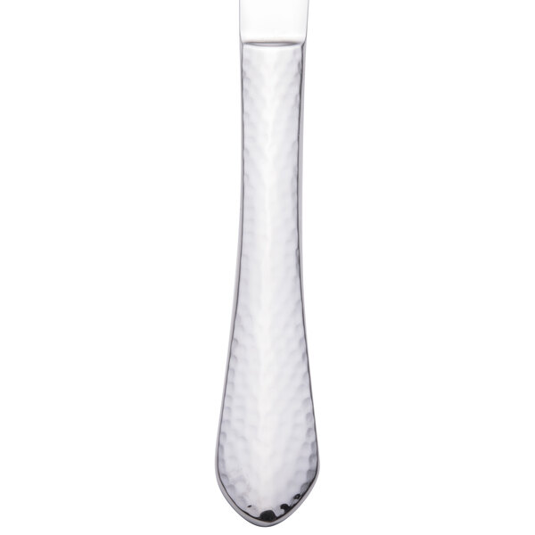 A Walco stainless steel dinner knife with an extra heavy weight and a black handle.