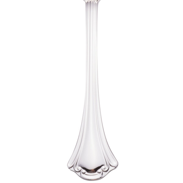 A silver Walco European table fork with a white background.