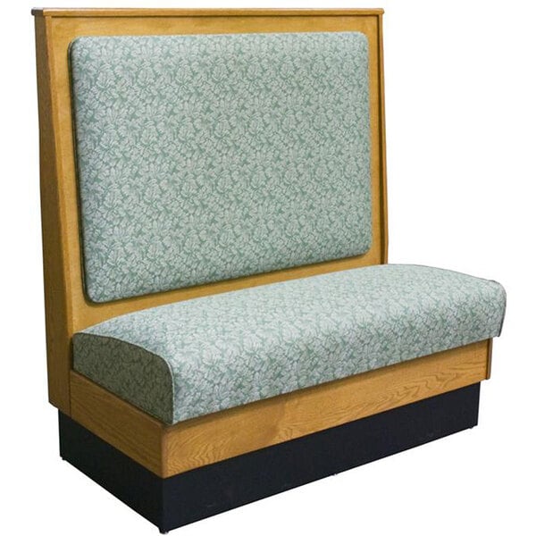 An American Tables & Seating wood booth with a cushioned bench seat.