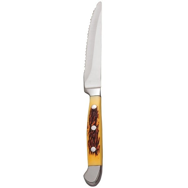A Libbey stainless steel steak knife with a yellow POM handle.