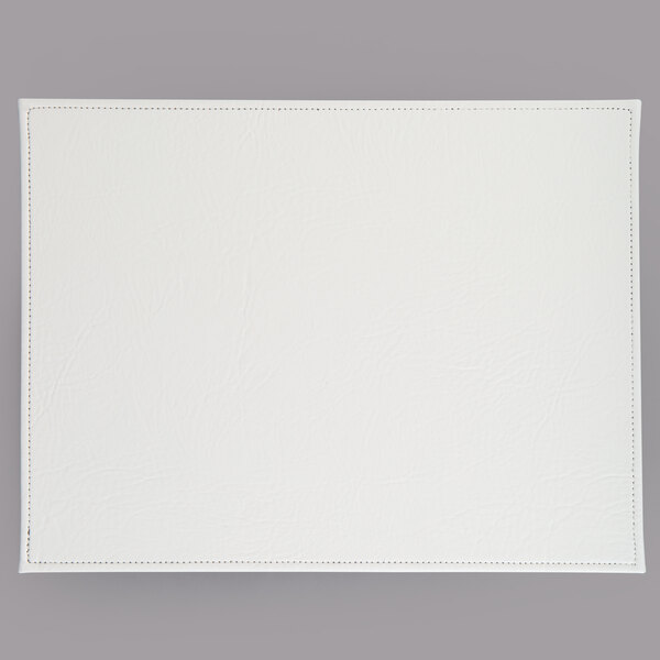 A white hardboard rectangular placemat with a white faux leather surface and stitching.