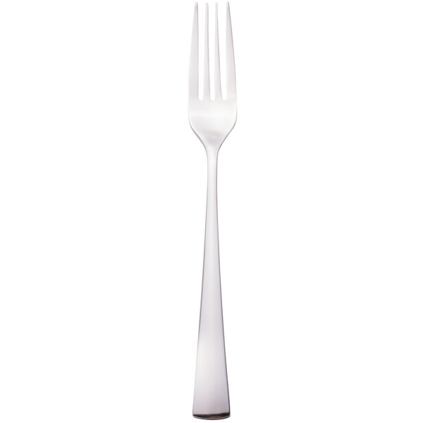 A close-up of a Walco Freya stainless steel table fork with a white handle.