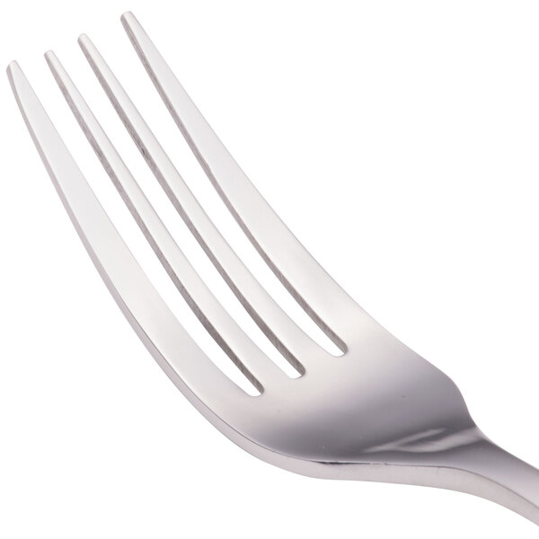 A close-up of a Walco Freya stainless steel European table fork.