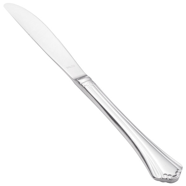 A Walco stainless steel dinner knife with a handle.