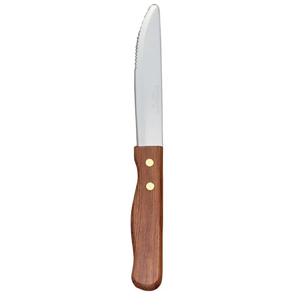 A Libbey stainless steel steak knife with a wooden handle.