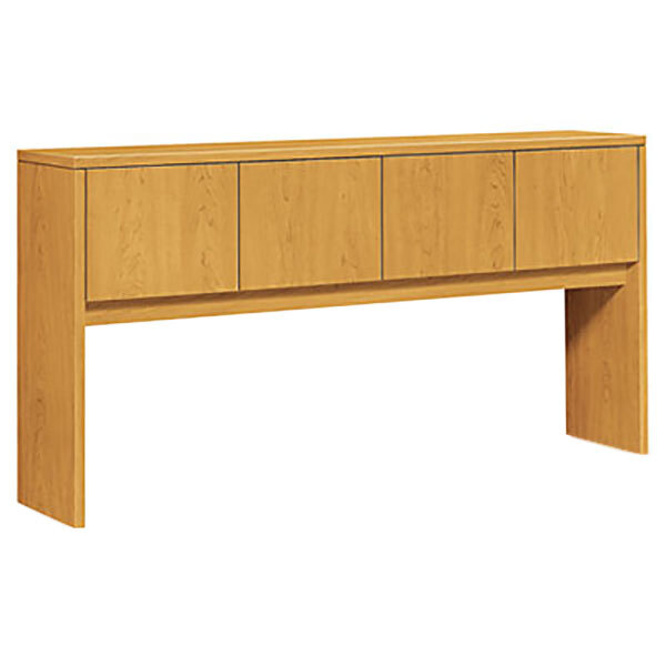 A wooden HON stack-on storage hutch with a cabinet and drawers.