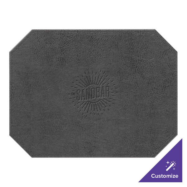 A grey faux leather octagon placemat with a logo on it.