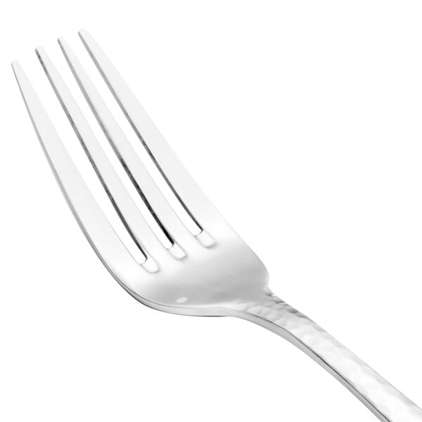 A close-up of a Walco stainless steel salad fork with a silver handle.