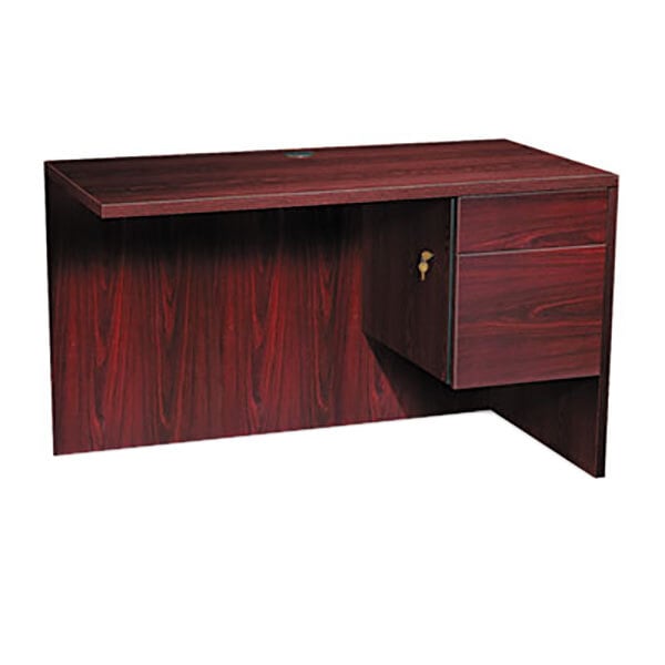 A mahogany HON 3/4 pedestal return with a drawer and cabinet.