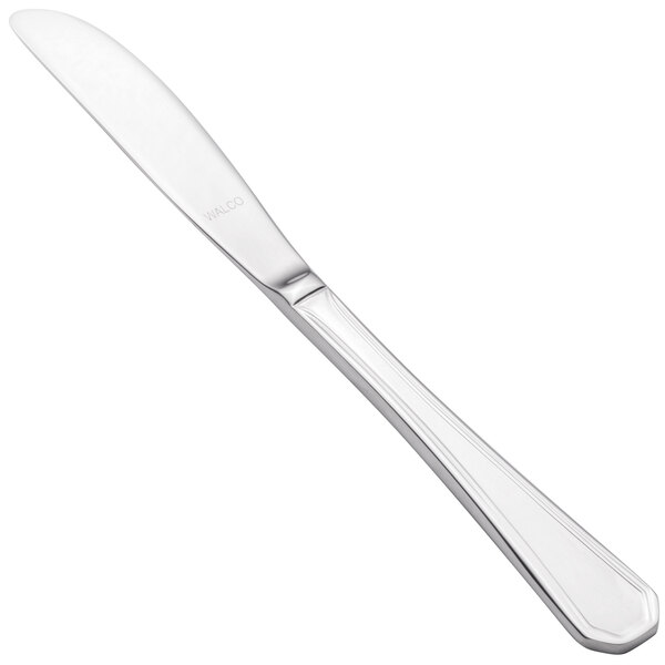 A Walco Prim stainless steel butter knife with a solid handle.