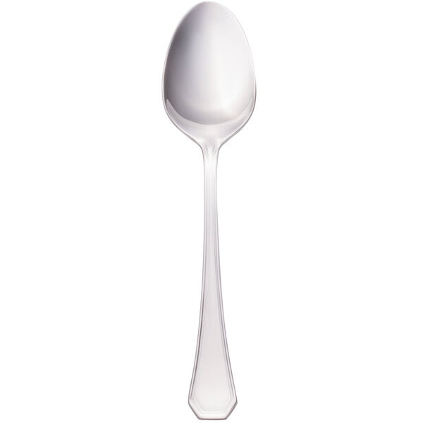 A Walco stainless steel serving spoon with a silver handle on a white background.