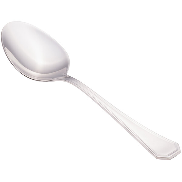 A close-up of a Walco stainless steel serving spoon with a silver handle.