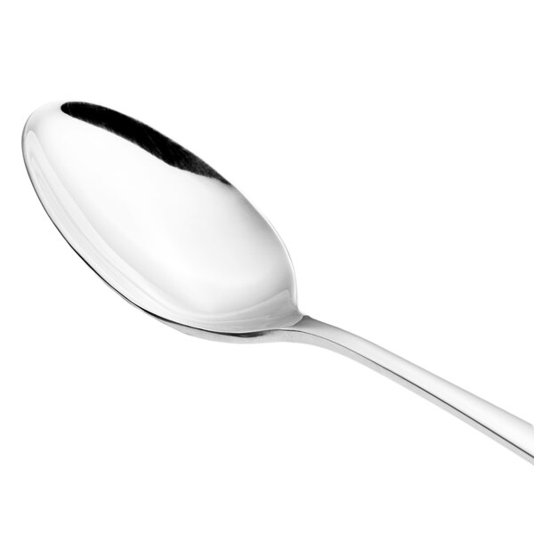 A close-up of a Walco Freya stainless steel serving spoon with a silver handle.