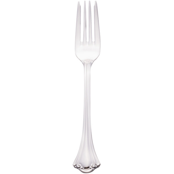 A close-up of a Walco stainless steel salad fork with a silver handle.