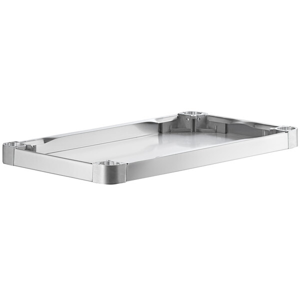 A Regency stainless steel undershelf for an adjustable work table.