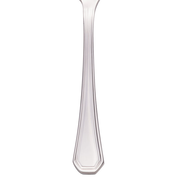 A silver Walco Prim stainless steel demitasse spoon.