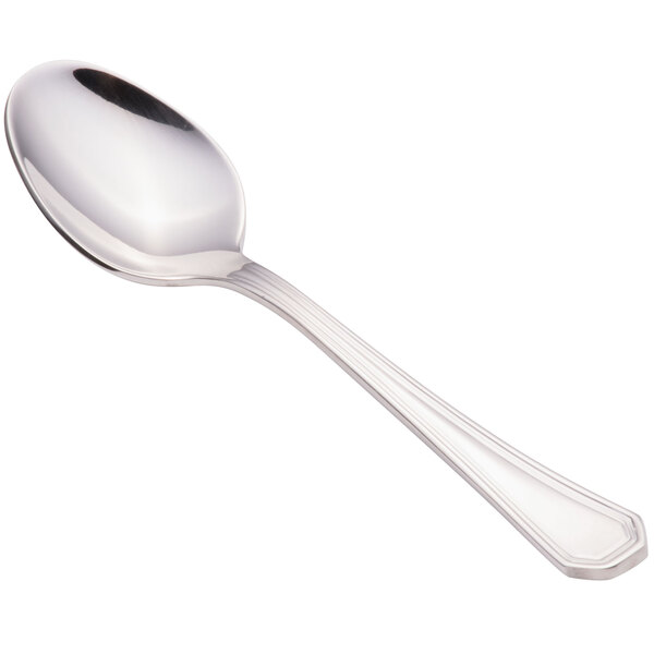 A close-up of a Walco stainless steel demitasse spoon with a white background.