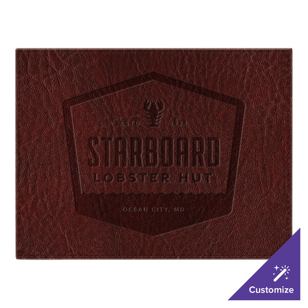 A brown faux leather rectangle placemat with a logo on it.