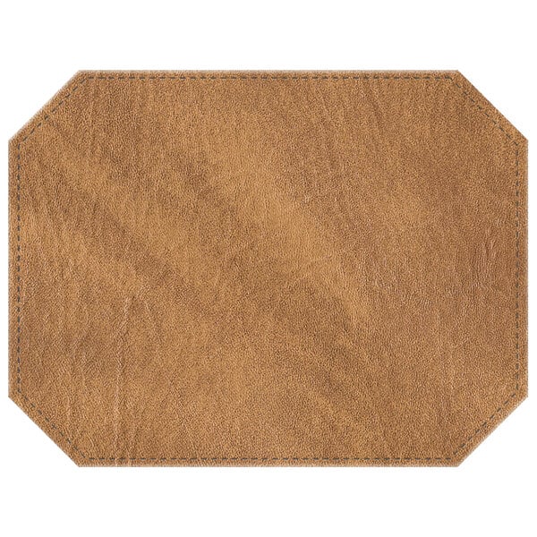 A brown octagon hardboard and faux leather placemat with stitching.