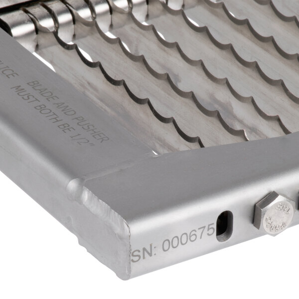 A close-up of an Edlund Titan Max-Cut 1/2" Slicer Blade and pusher.