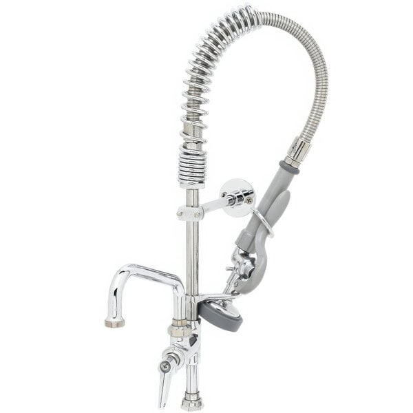 A chrome T&S pre-rinse faucet with a hose and add-on faucet.