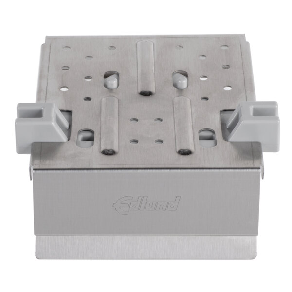 An Edlund Titan Max-Cut push block assembly with two metal holes.