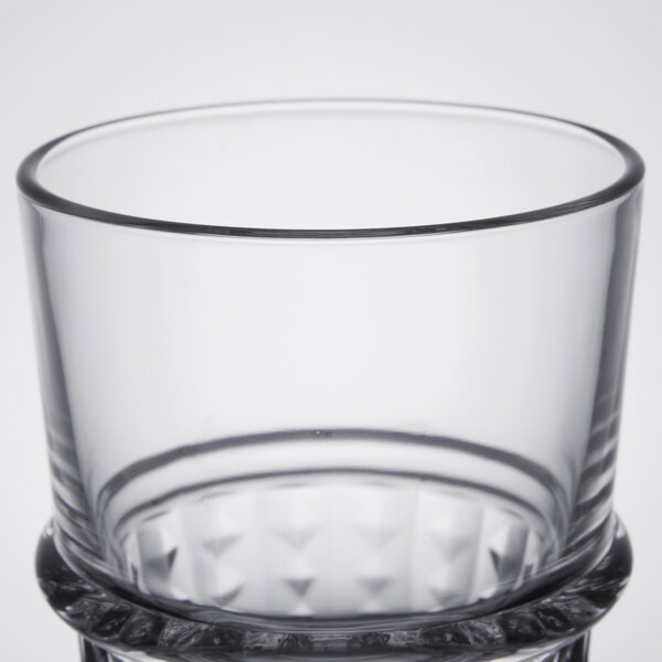 An Arcoroc clear glass with a diamond pattern on it.