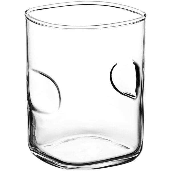 A clear Acopa juice glass with a thumbprint design.
