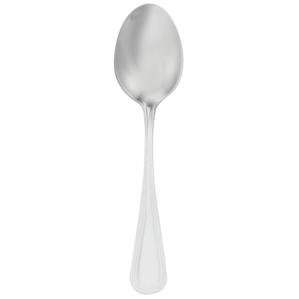 A silver Walco Classic Bead dessert spoon with a white handle.